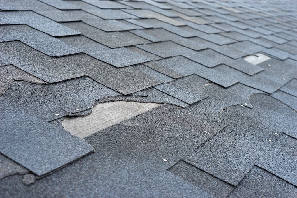 damaged roof needing inspection after a storm